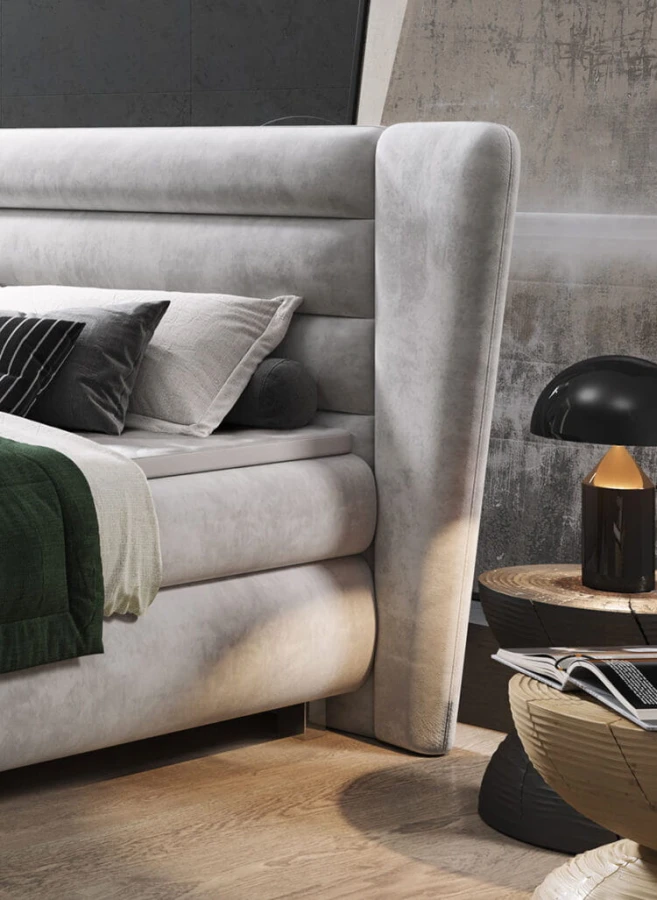 Nahaufnahme eines grauen Polsterbett-Kopfteils in modernem Schlafzimmer-Design.