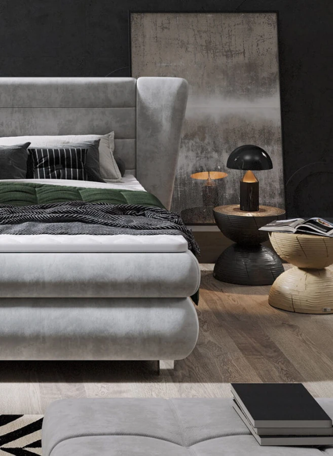 Modernes hellgraues Boxspringbett mit Nachttisch und stilvoller Beleuchtung im Schlafzimmer.