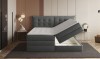 Graues Boxspringbett mit praktischem, seitlich zu öffnendem Bettkasten für Stauraum.