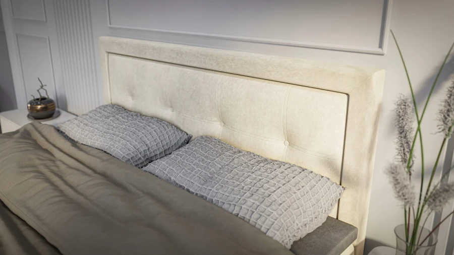 Beige gepolstertes Kopfteil mit Knopfheftung und grauen Kissen in einer hellen Schlafzimmerumgebung.