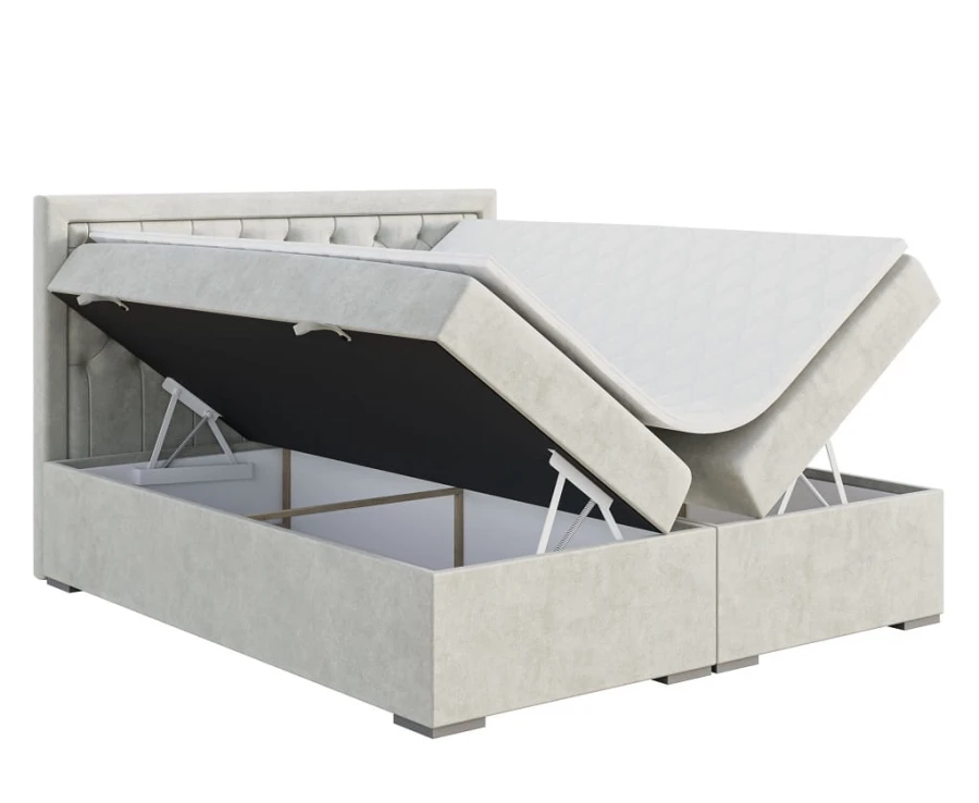 Graues Boxspringbett mit gestepptem Kopfteil und zwei offenen Bettkästen zur Aufbewahrung.