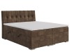 Braunes Boxspringbett mit dekorativ gestepptem Kopfteil geschlossen.