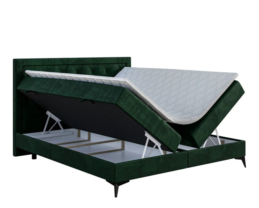 Grünes Samt-Boxspringbett mit zwei geöffneten Bettkästen für viel Stauraum.