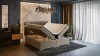 Modernes Boxspringbett in Beige mit offenem Bettkasten für zusätzlichen Stauraum im Schlafzimmer.