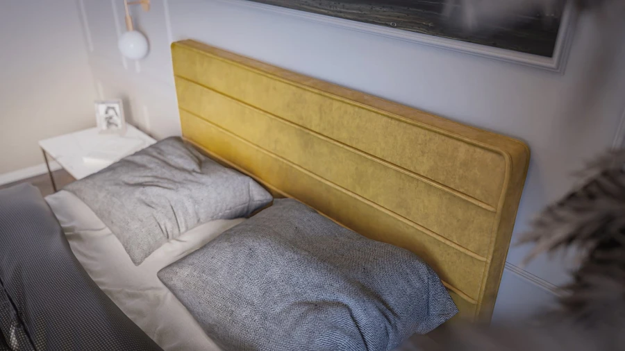 Detailansicht eines gepolsterten senfgelben Kopfteils mit Quersteppung in einem modernen Schlafzimmer.