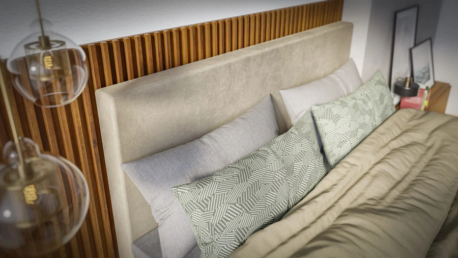 Detailaufnahme eines gepolsterten Kopfteils mit Dekokissen vor einer Holzwand.