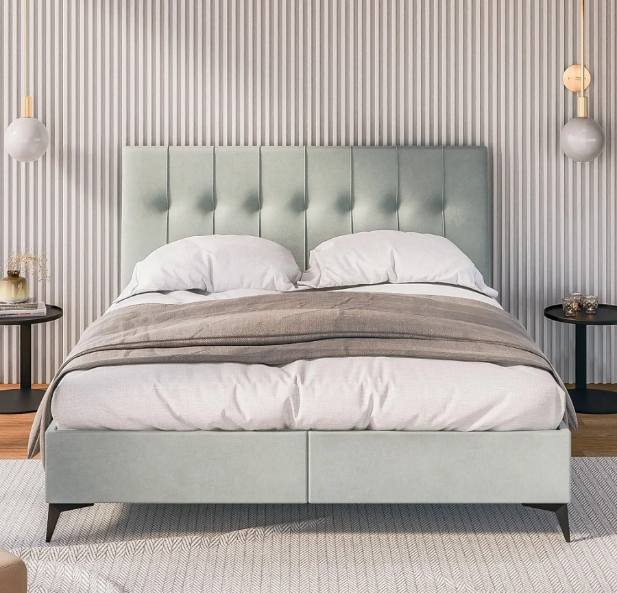 Elegantes Polsterbett in Mintgrün mit gestepptem Kopfteil und gemütlicher Bettwäsche im Schlafzimmer.