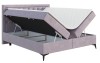 Boxspringbett in Flieder mit geöffnetem Bettkasten und Stauraum unter der Matratze.