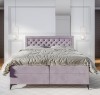 Stilvolles Schlafzimmer mit helllila Boxspringbett und modernem gestepptem Kopfteil.