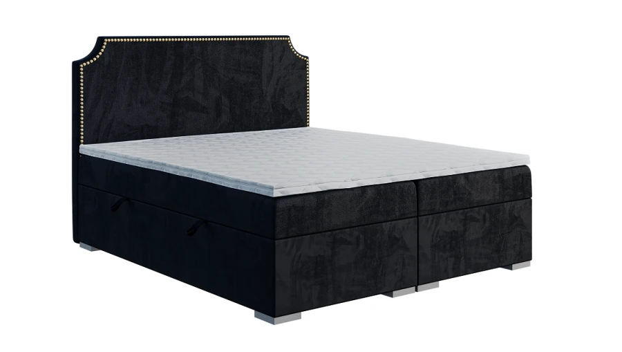 Stilvolles schwarzes Boxspringbett mit goldenen Nieten am Kopfteil und Bettkasten-Funktion.