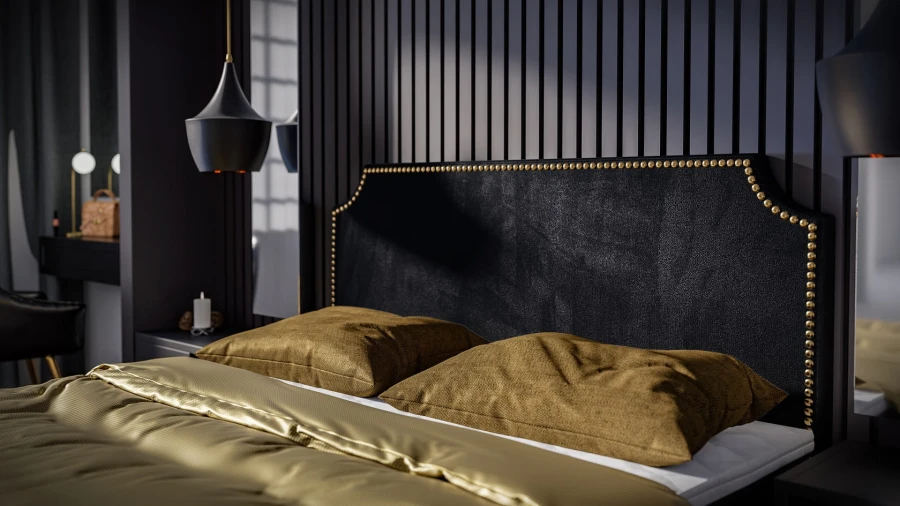 Schwarzes Kopfteil mit goldenen Nieten und gelber Bettwäsche im modernen Schlafzimmer.