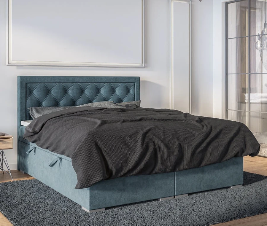 Blaues Polsterbett mit gestepptem Kopfteil und grauer Bettwäsche in modernem Schlafzimmer.