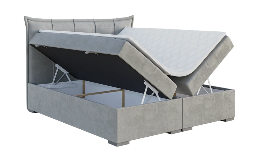 Graues Boxspringbett mit offenem Bettkasten und Hebemechanismus für praktischen Stauraum.