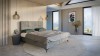 Eingerichtetes graues Boxspringbett in modernem Schlafzimmer mit Bergpanorama.