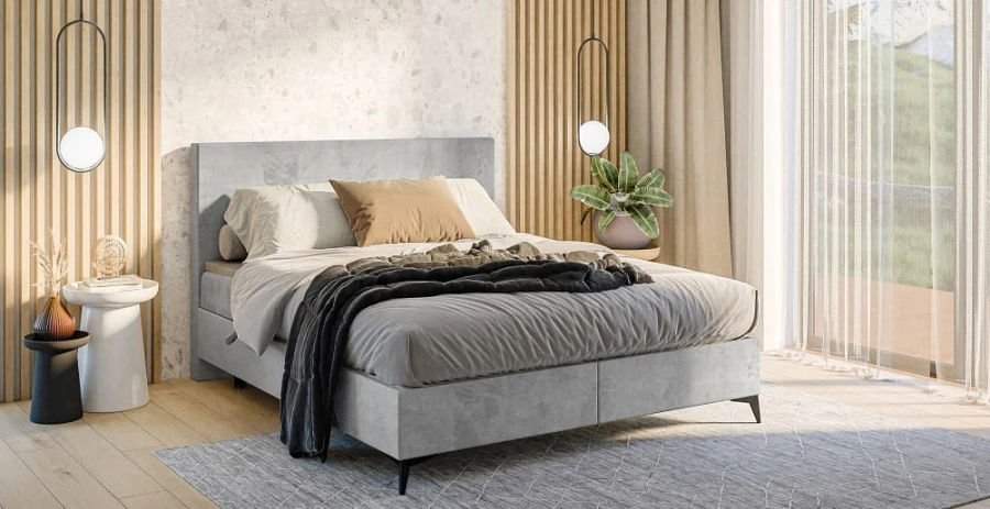 Modernes graues Boxspringbett in einem hellen Schlafzimmer mit Holzpaneelen.