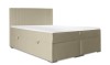 Modernes Boxspringbett in Beige mit gepolstertem Kopfteil und praktischem Stauraum für das Schlafzimmer.