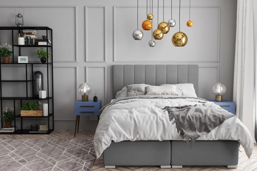 Modernes Schlafzimmer Design mit grauem Boxspringbett und Designer-Lampen.