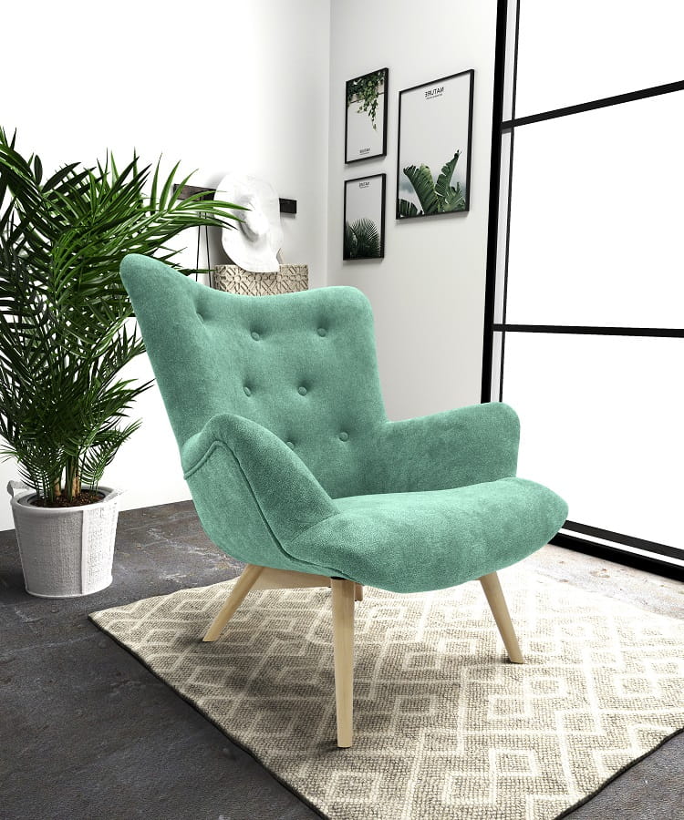 Moderner Ohrensessel in Mintgrün mit Holzbeinen im Wohnzimmer.