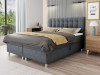 Dunkelgraues Boxspringbett mit Steppung in modernem Zimmer