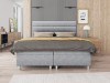 Modernes graues Boxspringbett mit gepolstertem Kopfteil im stilvollen Schlafzimmer.