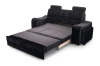 Komplett ausgezogene Liegefläche des Schlafsofas mit Krokodil-Muster in Schwarz.