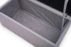 Innenansicht des Bettkastens eines Sofas mit grauer Stoffauskleidung für zusätzlichen Stauraum.