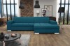 Türkisfarbenes Ecksofa in modernem Wohnzimmer mit Ziegelwand und Loft-Ambiente.