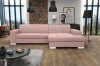 Modernes rosa Ecksofa in stilvollem Wohnzimmer mit Ziegelwand und Couchtisch.