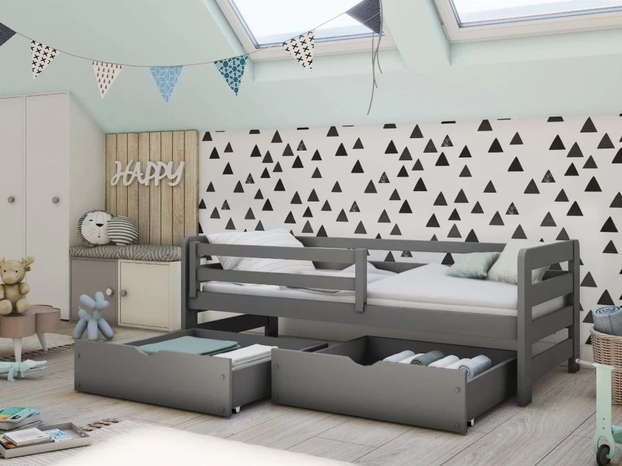 Dunkelgraues Kinderbett mit Bettkasten und Rausfallschutz für das Kinderzimmer.