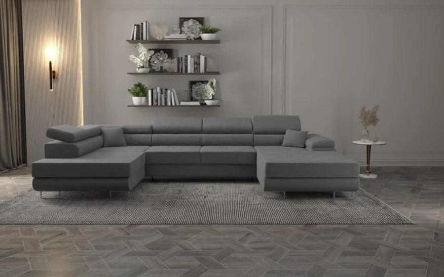 Moderne graue Wohnlandschaft in U-Form im stilvoll eingerichteten Wohnzimmer auf einem Teppich.