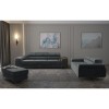 Elegantes graues Wohnzimmer-Set bestehend aus Sofa, Couch und Polsterhocker.