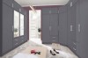 Großes modulares Schranksystem in Anthrazit als Ecklösung für ein modernes Ankleidezimmer.