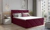 Modernes Polsterbett in Beerenrot mit Rautensteppung in einem hellen Schlafzimmer.