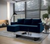 Modernes blaues Ecksofa aus Samt in stilvollem Wohnzimmer mit schwarzem Couchtisch und Teppich.