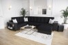 Stilvolles schwarzes U-Sofa mit dunklem Stoffbezug und praktischem Ablagefach.