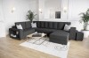 Dunkelgraues L-Form Sofa mit praktischem Regal im Seitenteil.
