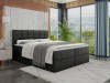 Modernes Boxspringbett in Anthrazit mit gepolstertem Kopfteil und dekorativen Knöpfen im Schlafzimmer.