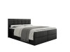 Anthrazitfarbenes Boxspringbett mit gestepptem Kopfteil und weißer Bettwäsche auf weißem Hintergrund.