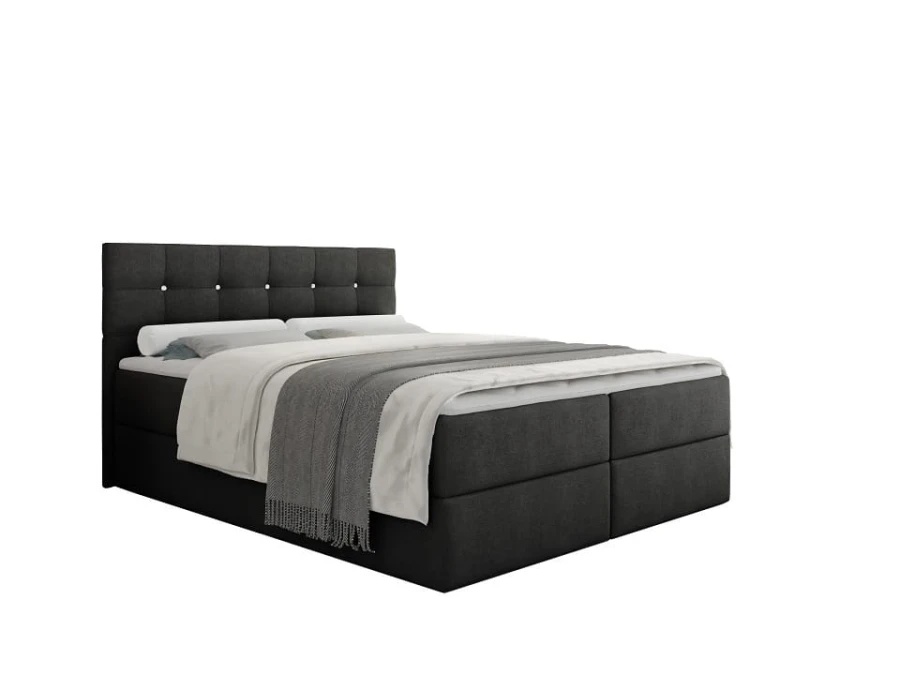 Anthrazitfarbenes Boxspringbett mit gestepptem Kopfteil und weißer Bettwäsche auf weißem Hintergrund.