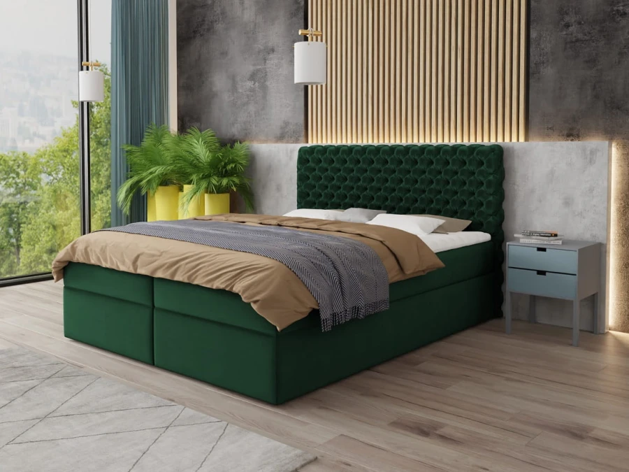 Grünes Boxspringbett mit gestepptem Kopfteil in modernem Schlafzimmer-Interieur.