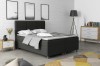 Dunkelgraues Boxspringbett mit dreigeteiltem Kopfteil in modernem Schlafzimmer.