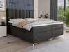 Dunkelgraues Boxspringbett mit vertikal gestepptem Kopfteil und Metallfüßen.