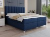 Elegantes blaues Boxspringbett mit hohem Kopfteil in modernem Schlafzimmerambiente.