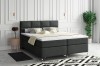 Modernes Boxspringbett in Dunkelgrau im stilvoll eingerichteten Schlafzimmer
