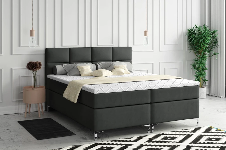 Modernes Boxspringbett in Dunkelgrau im stilvoll eingerichteten Schlafzimmer