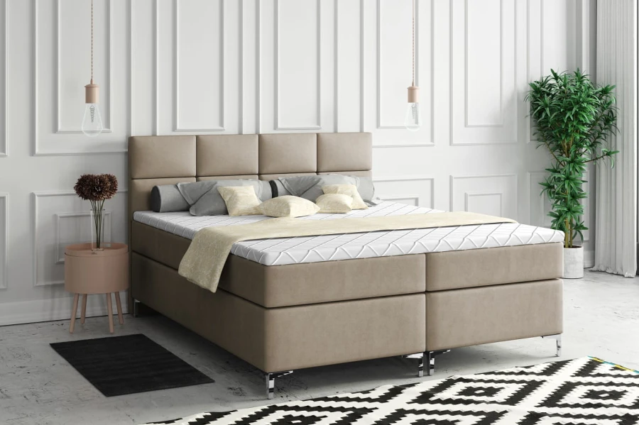 Elegantes Boxspringbett in Beige im hellen Schlafzimmer-Ambiente