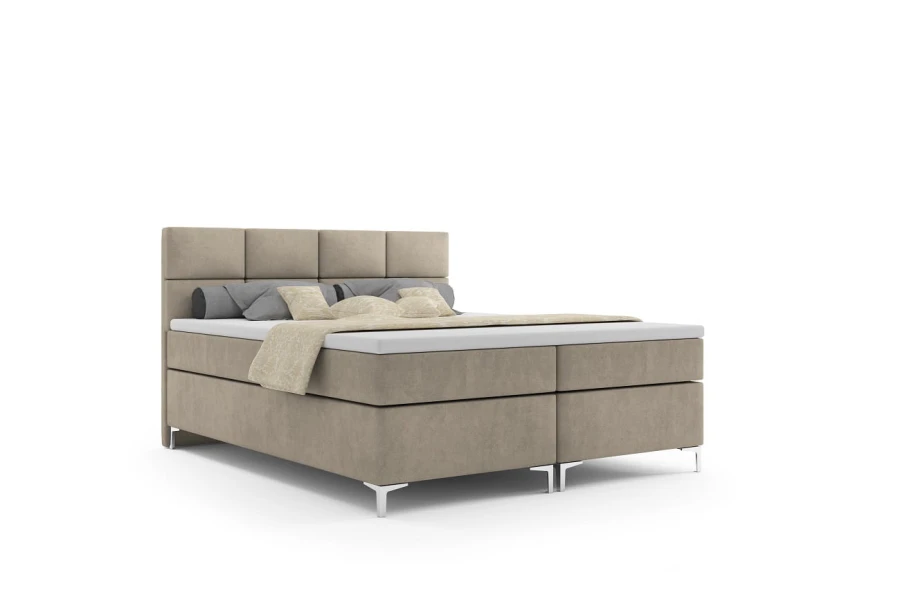 Beiges Boxspringbett mit modernem Kopfteil, freigestellt auf Weiß