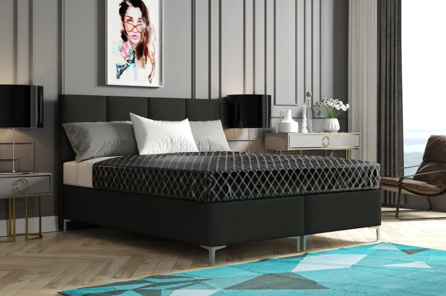Modernes Boxspringbett in Schwarz mit gestepptem Kopfteil im stilvollen Schlafzimmer.