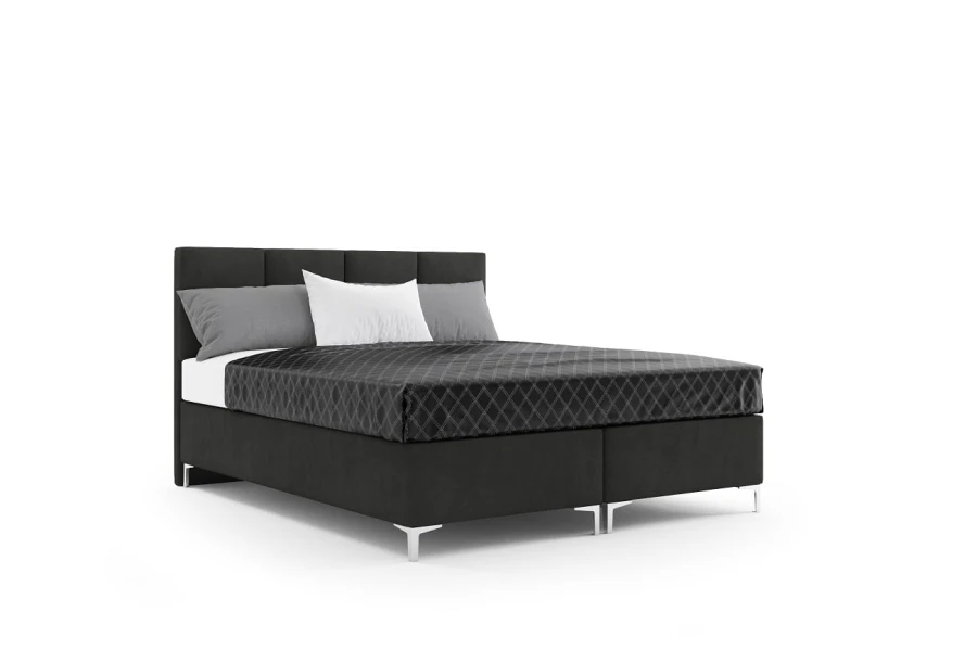 Schwarzes Boxspringbett mit silbernen Füßen und grauer Bettwäsche auf weißem Hintergrund.