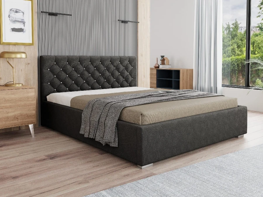 Dunkelgraues Bett mit Stoffbezug und dekorativer Knopfheftung.
